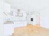 Exklusive 3-Zimmer-Wohnung mit Südwest-Balkon und Blick in den parkähnlichen Innenhof - Elegantes Küchenensemble in moderner Ausführung