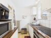 Vermietetes 1-Zimmer-Apartment mit großem Balkon und Weitblick in Unterhaching - Küche