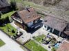 Einfamilienhaus mit besonderem Charme zur Sanierung auf großem Grundstück - Hausansicht aus der Vogelperspektive