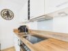 Modernes City-Apartment mit Südloggia - Zeitlose Einbauküche