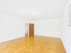 Charmante 3-Zimmer-Wohnung in ruhiger Lage von Solln mit Balkon und Gartenanteil - Wohnzimmer
