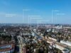 2-Zimmer-Dachgeschosswohnung mit offenem Wohnkonzept - Panoramablick über München mit Orientierungspunkten