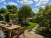 Charmantes Eckhaus mit drei Wohneinheiten und sonnigem Grundstück - Visualisierung: Blick in den großzügigen Gartenbereich